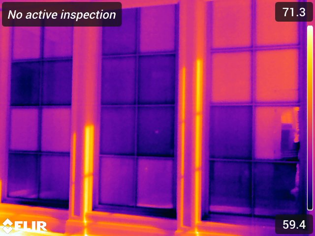 Thermal capture of a window wall showing temperature differences across the frames